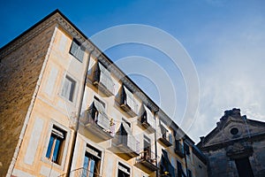 Traditional spanish architecture in the small streets of old town Girona in Catalonia on a sunny day