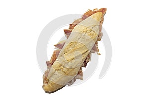 Traditional Spanish bocadillo ham sandwich with a crusty bread isolated on a white background