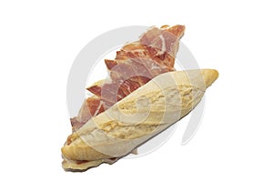 Traditional Spanish bocadillo ham sandwich with a crusty bread isolated on a white background