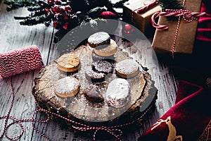 Traditional Spanish Christmas candy. Andalusian Shortbread cookies Polvorones on oak tree trunk