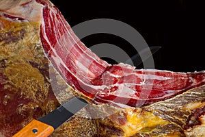 Traditional spanish jamon serrano, italian parma, hamon iberico, prosciutto, leg photo