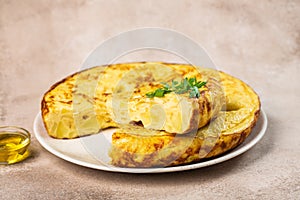 Traditional spanish omelette with eggs on a table