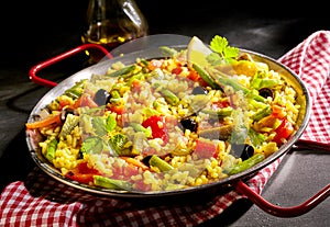 Traditional Spanish paella verduras photo
