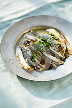 Traditional Spanish pintxos of Cantabrian anchovies in olive oil