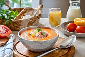 Traditional Spanish Salmorejo Soup. Chilled tomato and bread soup with garnishes.