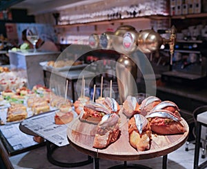 Traditional spanish snacks, tapas, pintxos in bar, cafe in Basque country, Spain