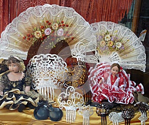 Traditional Spanish souvenirs, fans, castanet, flamenco dolls on sale