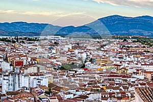 Traditional Spanish whitewashed village with mountain and ruined castle on the sumit. Monochrome black and white