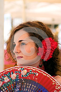 Traditional Spanish Woman with Red Fan