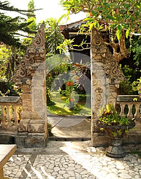 Traditional split gate in balinese garden