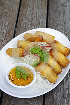 Traditional spring rolls on the wooden table