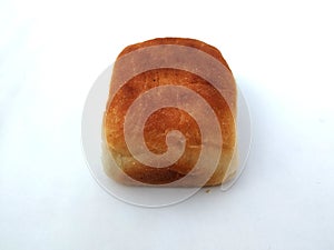 A traditional square loaf of bread is  on a white background. bread isolated on a white background.