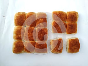 A traditional square loaf of bread is  on a white background. bread isolated on a white background.