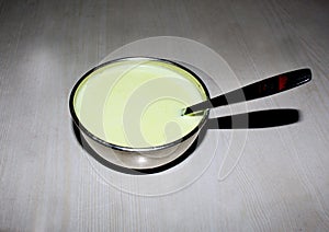 Traditional steamed milk pudding in a silver bowl