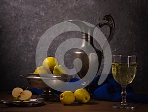 Traditional still life with an jug, wine and pears