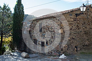 Traditional stone facade in Patones de Arriba, Madrid, Spain photo