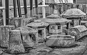 Traditional stone lanterns and parts for stone statues seen in p photo