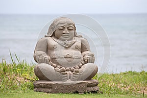 Traditional stone sculpture on the beach in Kuta, Bali, Indonesia