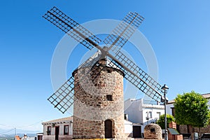 Traditional stone windmill in old town of Banos de la Encina, Jaen, Andalusia, Spain