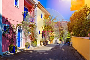 Traditional street with greek houses with flowers in Assos, Kefalonia island. Traditional colorful greek houses in Assos village.