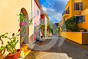 Traditional street with greek houses with flowers in Assos, Kefalonia island. Traditional colorful greek houses in Assos village.