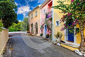 Traditional street with greek houses with flowers in Assos, Kefalonia island. Traditional colorful greek houses in Assos village.