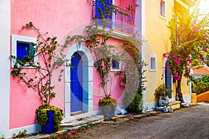Traditional street with greek houses with flowers in Assos, Kefalonia island. Traditional colorful greek houses in Assos village.