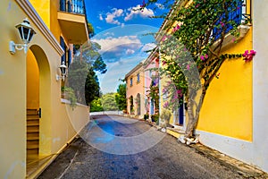 Traditional street with greek houses with flowers in Assos, Kefalonia island. Traditional colorful greek houses in Assos village.