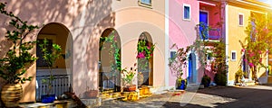 Traditional street with greek houses with flowers in Assos, Kefalonia island. Traditional colorful greek houses in Assos village.