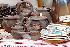 Traditional style modern handmade ceramic clay decorative twin crocks double pots with a handle and cover lids, carved patterns