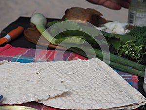 Traditional Swedish bread tunnbrÃ¶d and vegetables on the table