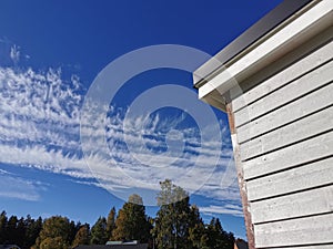 Traditional Swedish  gray house on sky background