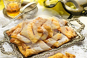 Traditional sweet crisp Angel wings with powdered sugar and rum