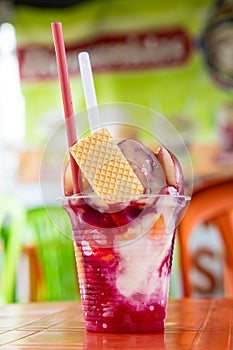 Traditional sweet water ice with fruits called cholado in the city of Cali in Colombia photo