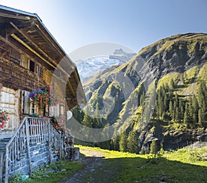 Traditional swiss house in mountain valley Kiental