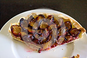 Traditional Swiss plum cake on a white plate