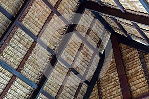 Traditional swiss thatch roof from the inside. Piece of a tap thatching that made from strips of Nipa leaves.
