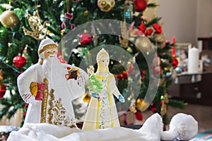 Traditional symbols of the Russian New Year are Santa Claus and Snow Maiden. Vintage Christmas toys. The atmosphere of