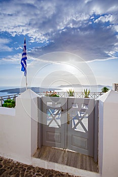 A traditional symmetric door yard, Ia, Santorini, Greece. Honeymoon summer aegean cycladic background.