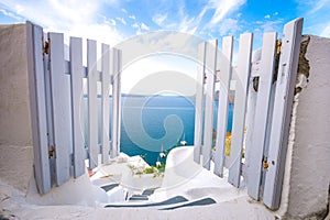 A traditional symmetric door yard, Ia, Santorini, Greece. Honeymoon summer aegean cycladic background.