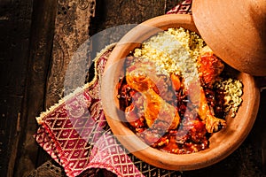 Traditional Tajine Dish with Chicken and Couscous photo