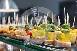 Traditional tapas and pinchos on a counter in a bar