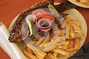 A traditional tasty festive dish in Uganda on the shores of Lake Victoria - freshly fried Tilapia fish