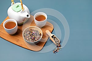 Traditional tea ceremony accessories, teapot and herbs and dry fruits tea. Destressing, relaxation, healing, healthy