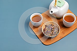 Traditional tea ceremony accessories, teapot and herbs and dry fruits tea. Destressing, relaxation, healing, healthy