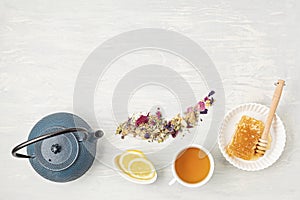 Traditional tea ceremony accessories, teapot and herbs and dry fruits tea. Destressing, relaxation, healing, healthy comforting,