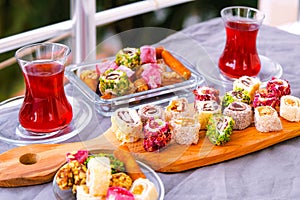 Traditional tea with locum sweets Turkish delight.