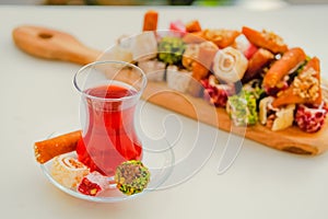 Traditional tea with locum sweets Turkish delight.