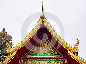 Traditional Temple Roof with Golden Serpents