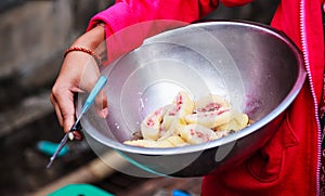 Traditional Thai Asian Dessert, Steamed Banana Cake or Pudding Kanom Gluay in street food market. A cross between cake, custard